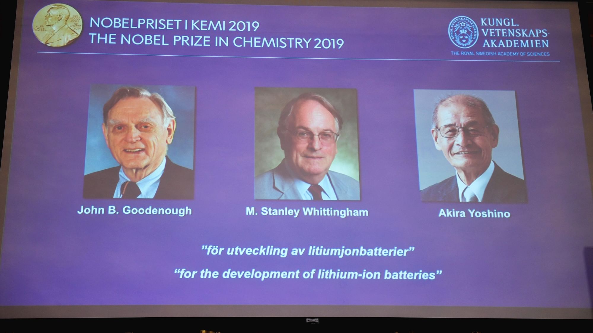 A screen displays the laureates of the 2019 Nobel Prize in Chemistry.