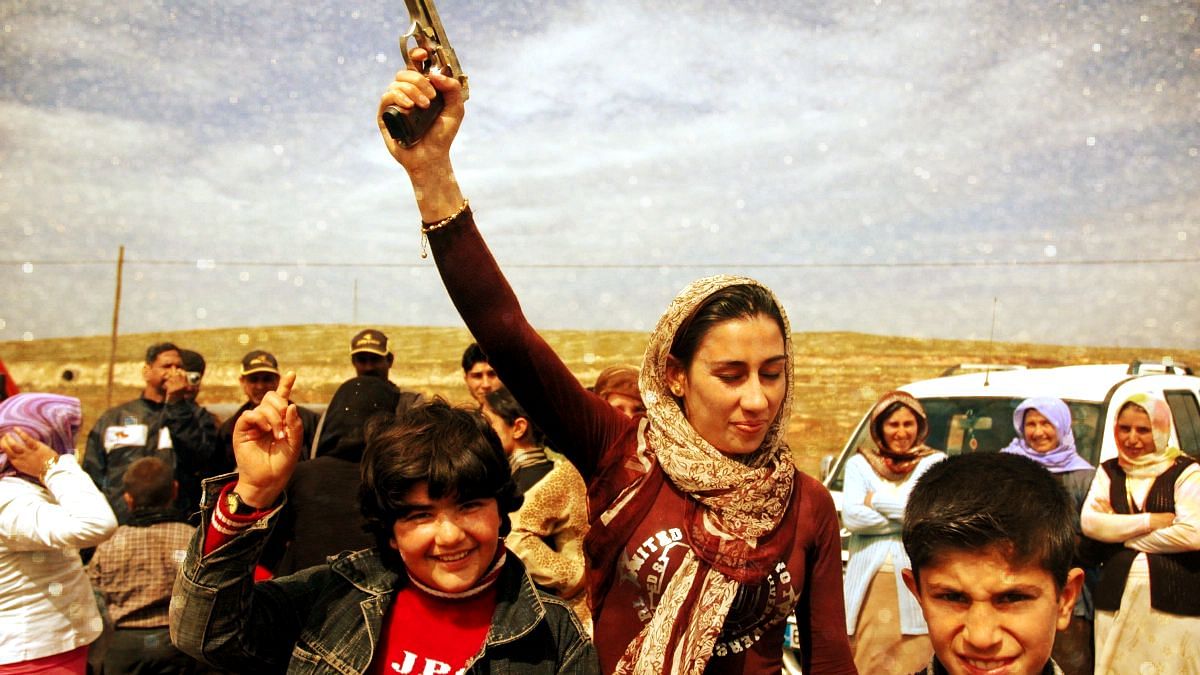 At a Kurdish wedding, men, women &amp; children firing in the air with an arsenal of 12-bore shotguns and pistols. Image used for representational purposes.