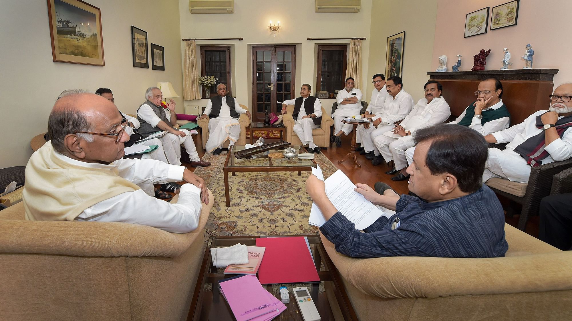 NCP Chief Sharad Pawar, senior Congress leader Ahmed Patel and others during a meeting regarding government formation in Maharashtra.