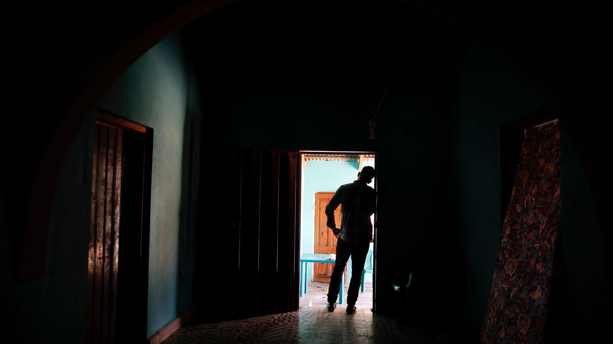 In this 23 August 2019 photo, a Honduran father stands at his home in Comayagua,&nbsp;