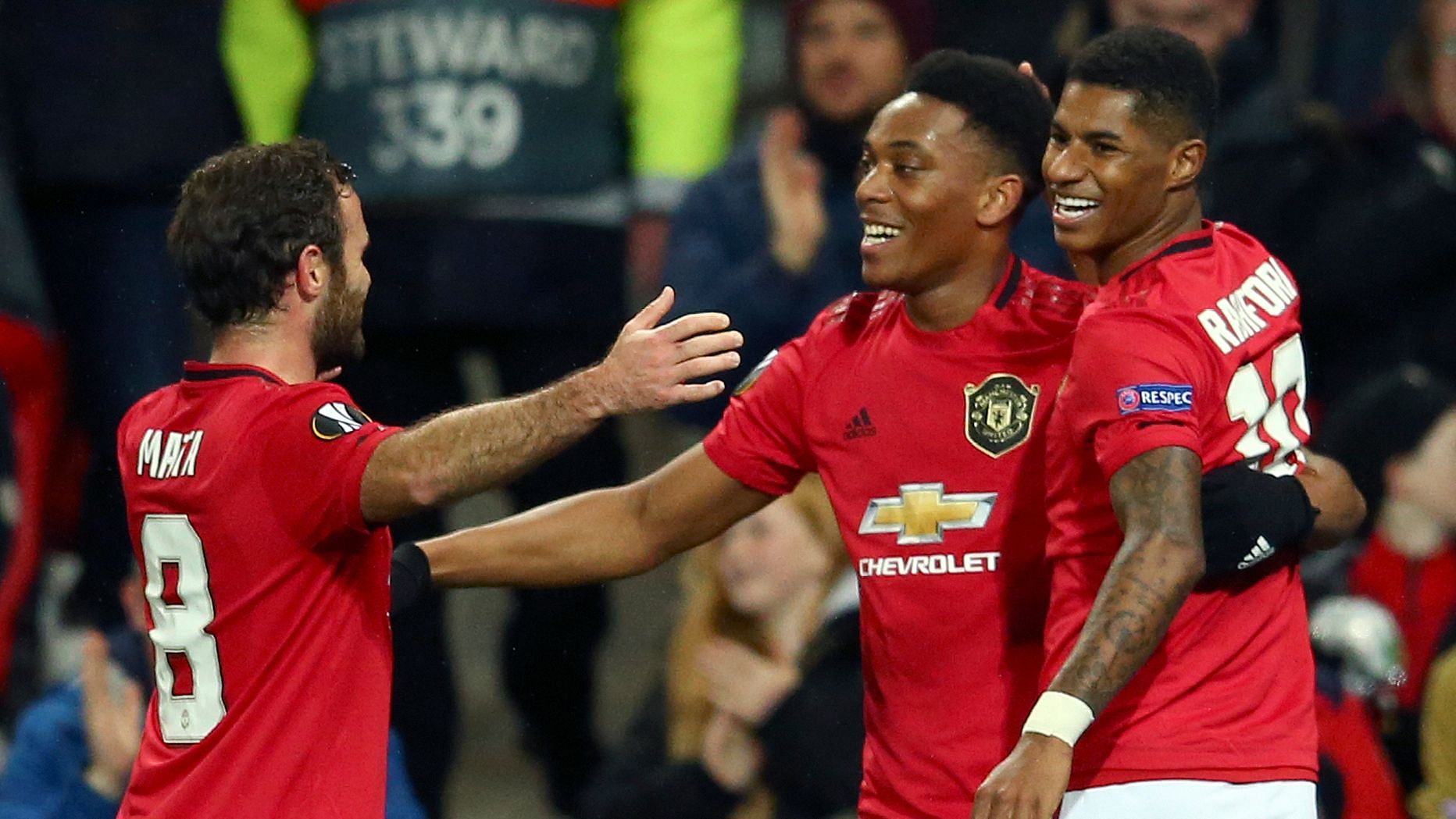 Manchester United’s Anthony Martial, center, celebrates with Juan Mata and Marcus Rashford.