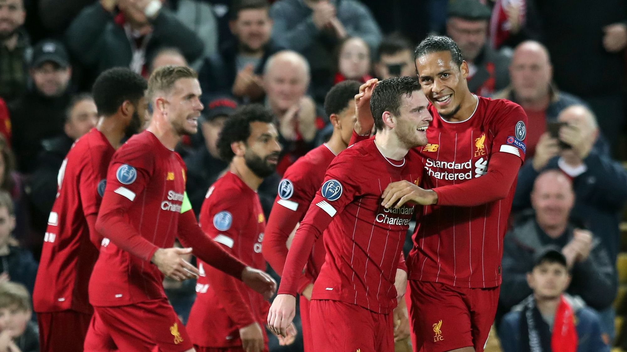 Liverpool celebrates after an Andrew Robertson goal in the Champions League.
