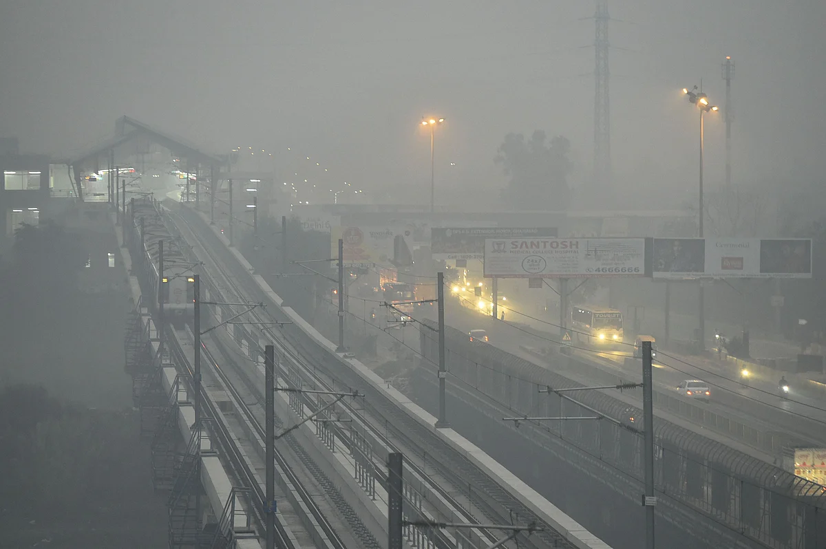 Delhi metro running amid dense haze and low visibility, in Ghaziabad on Thursday 31 October. 