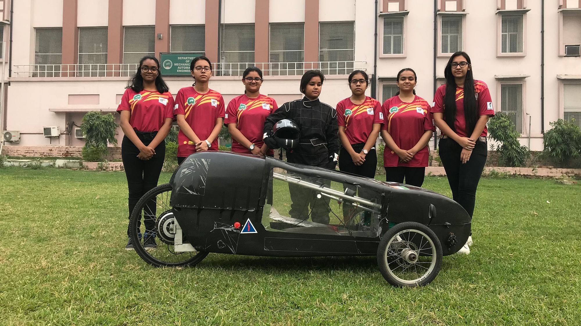 Students of Indira Gandhi Delhi Technical University for Women with their electric car that claims to do 250 Km on one unit of electricity.