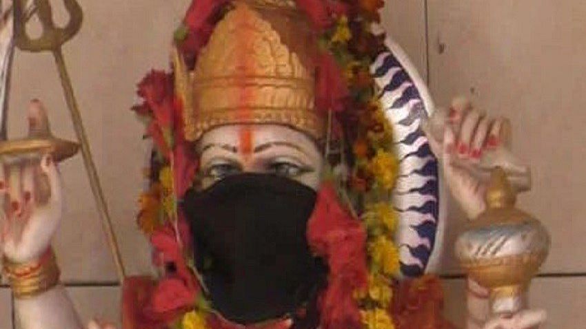 The face of an idol covered with mask at a temple n Varanasi.