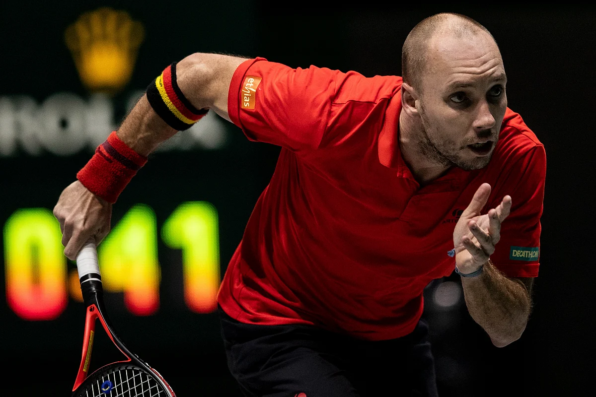 Belgium’s Steve Darcis runs for the ball during the Davis Cup tennis match against Colombia’s Santiago Giraldo in Madrid.