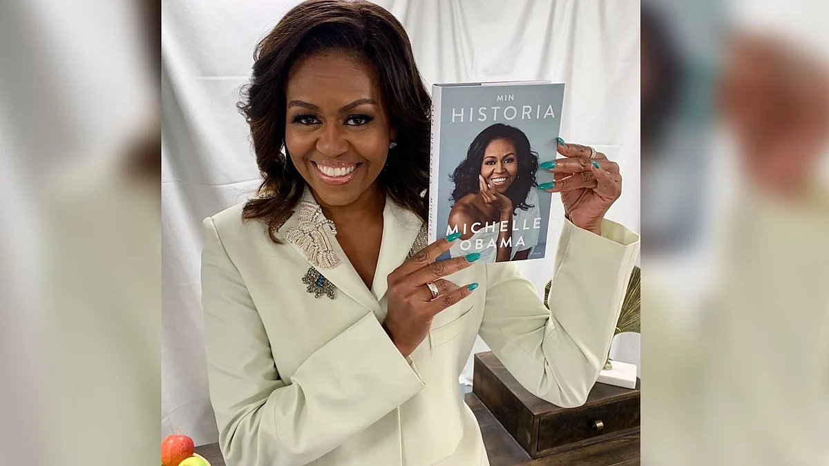 Michelle Obama poses with a European edition of her book. 