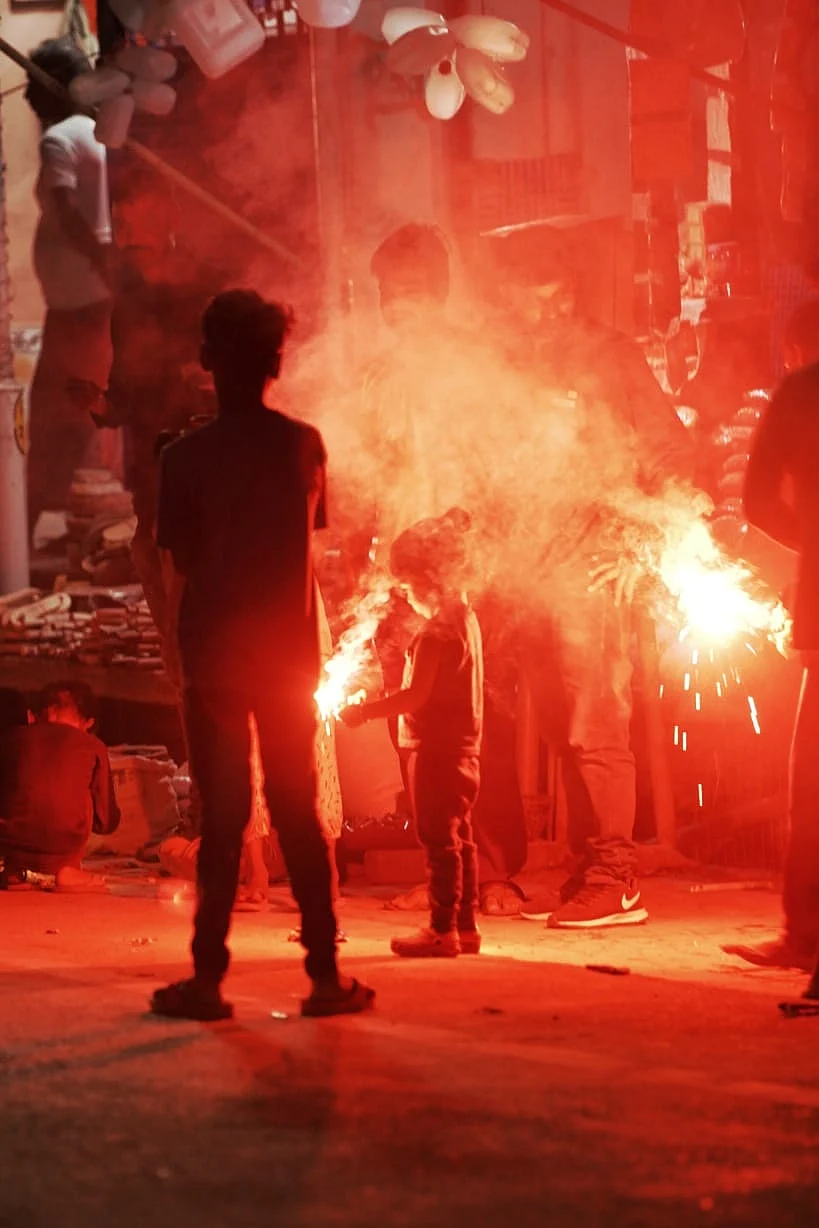 People celebrating with fireworks.