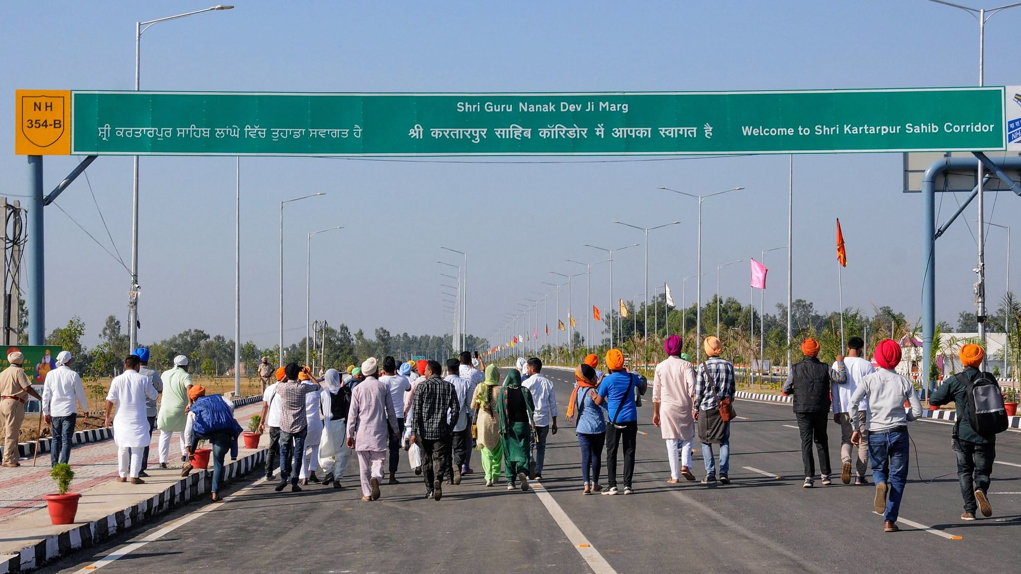  Sikh devotees stand with folded hands near the zero line as they pay obeisance facing the Kartarpur Sahib Gurdwara on the day of the inauguration of the Kartarpur corridor, in Gurdaspur. Image used for representation.