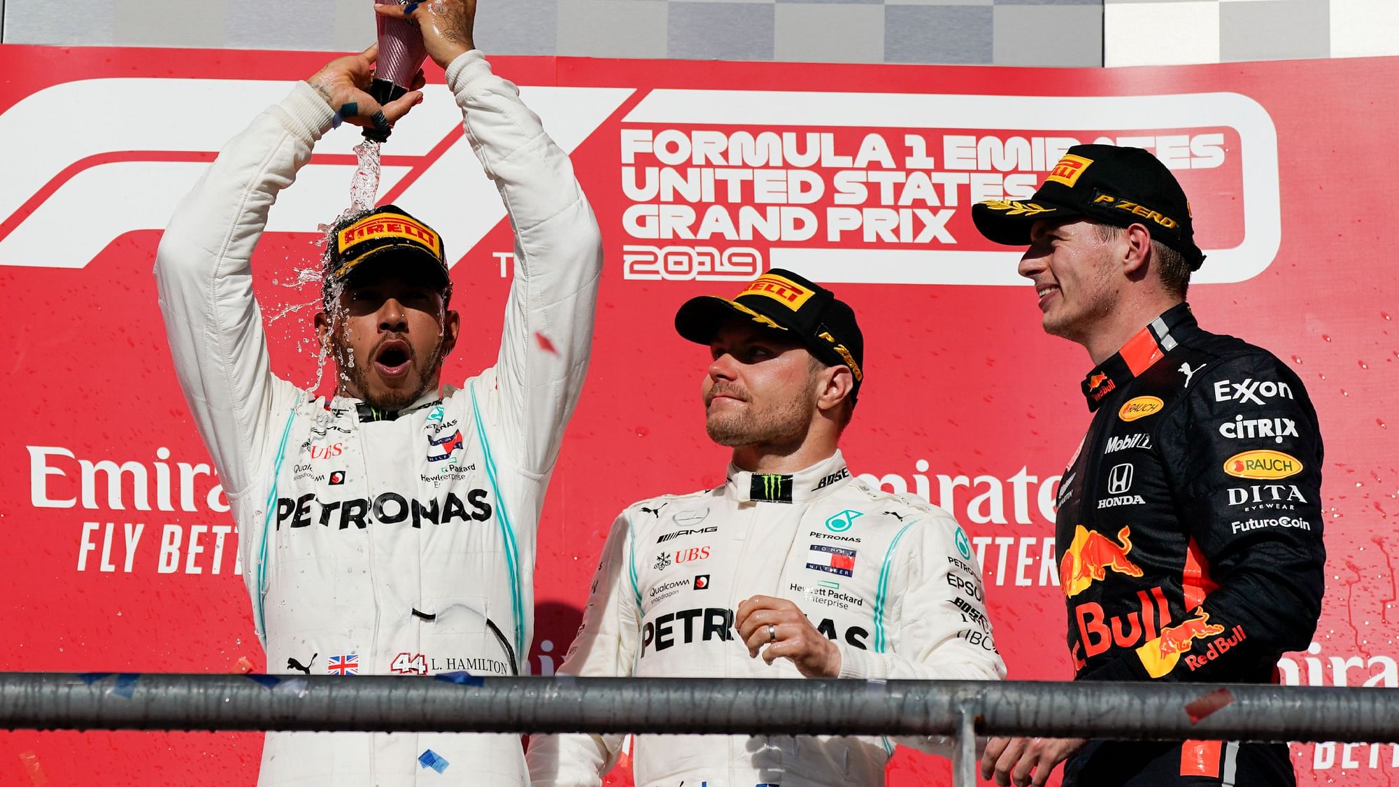Lewis Hamilton celebrates after winning his sixth F1 title.