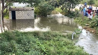 Bengaluru: Hulimavu lake breached and the water has flooded into many residents of surrounding areas of Hulimavu lake on Bannerghatta Road, in Bengaluru on Nov 25, 2019. (Photo: IANS)