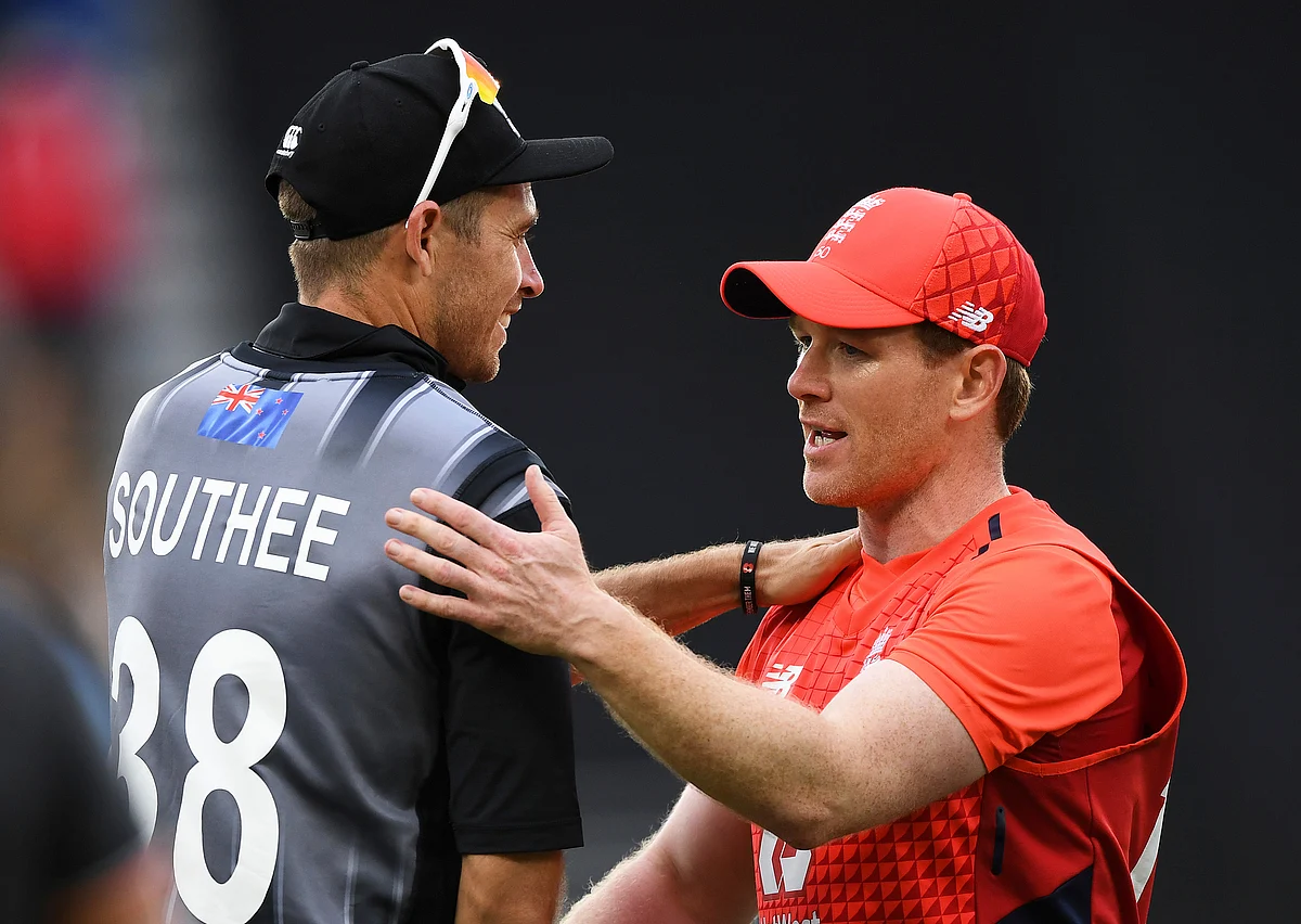 England captain Eoin Morgan consoles New Zealand captain Tim Southee, left, at the conclusion of the super over during their T20 cricket match at Eden Park, Auckland, New Zealand, Sunday, Nov. 10, 2019.