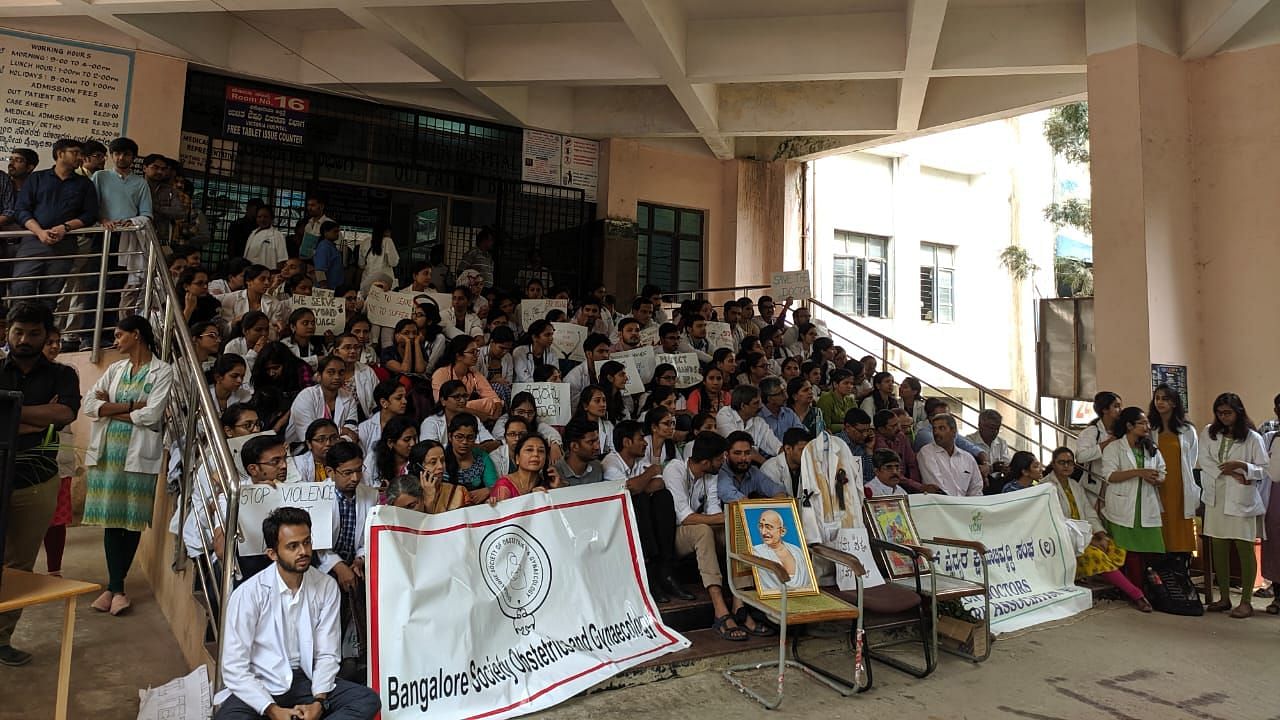 Scores of post graduate residents of Victoria Hospital sat in protest against the alleged harassment of a junior doctor at Minto Eye Hospital last week, demanding more stringent security measures.