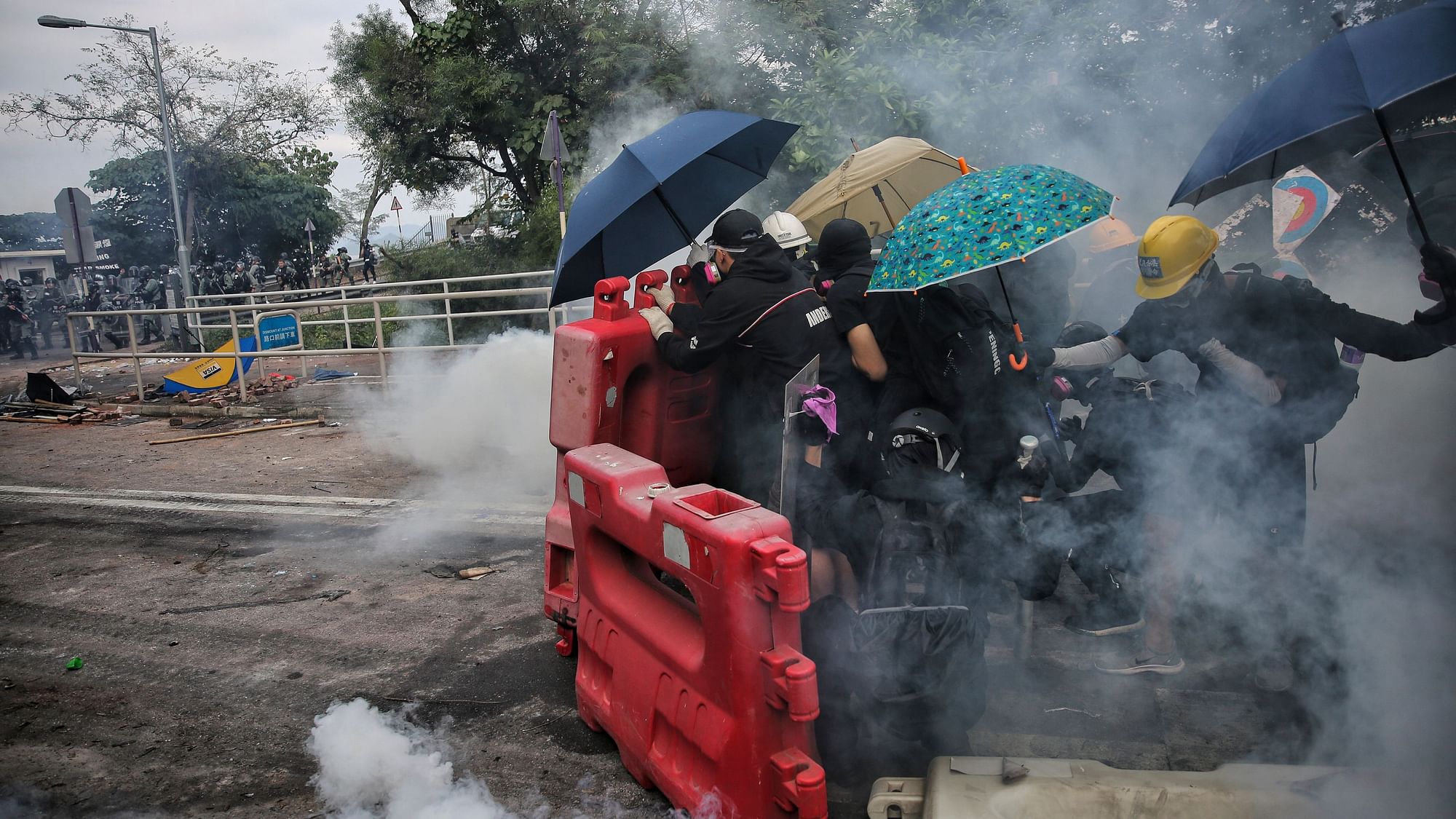 Police fired tear gas at protesters who littered streets with bricks and disrupted morning commutes.&nbsp;
