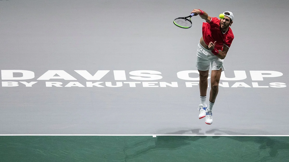 Russia’s Karen Khachanov serves to Croatia’s Borna Coric during their Davis Cup tennis match in Madrid, Spain, Monday.