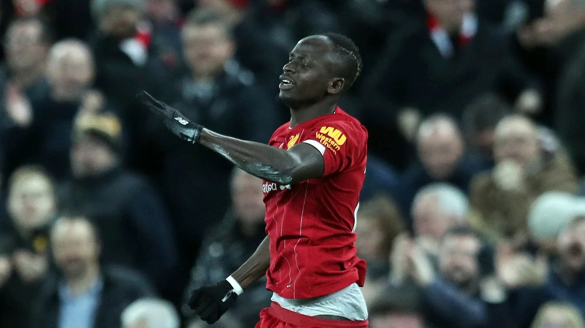 Liverpool’s Sadio Mane celebrates after scoring his side’s third goal during the English Premier League soccer match between Liverpool and Manchester City at Anfield stadium in Liverpool, England, Sunday, Nov. 10, 2019.