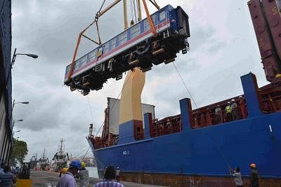 COLOMBO, Aug. 13, 2019 (Xinhua) -- Workers unload one of the carriages of an imported Chinese-made train at Colombo port in Sri Lanka, Aug. 13, 2019. Sri Lanka has imported a train from China for its upcountry line at a cost of 10.3 million U.S. dollar which will be the first of nine power sets, the island