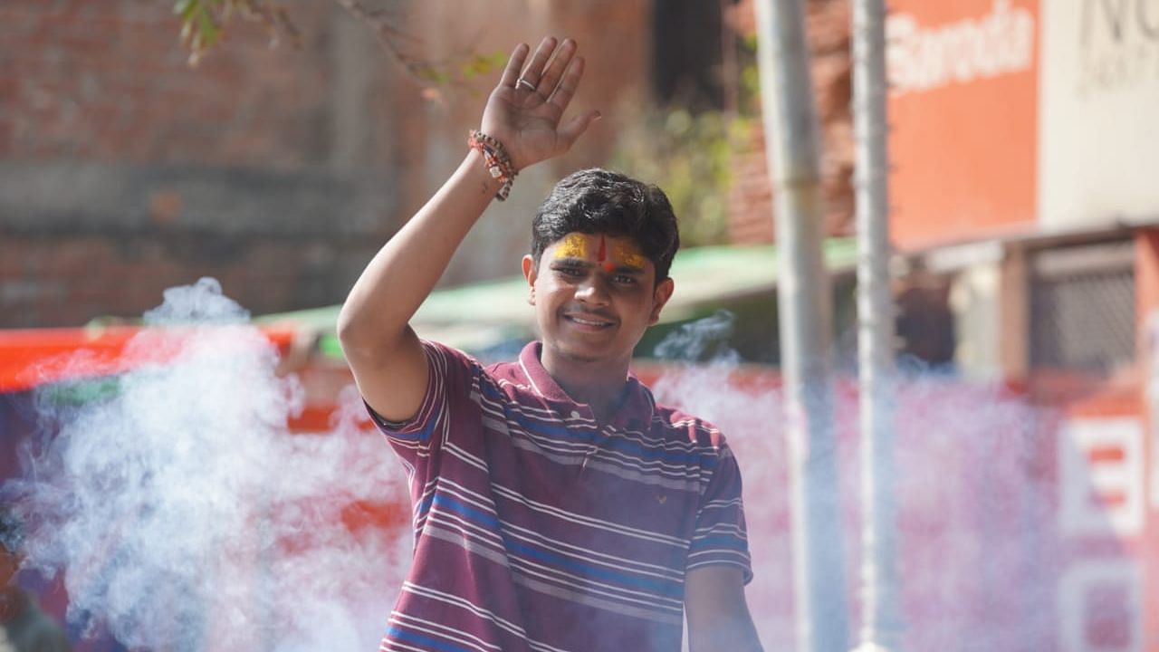 A youth in Ayodhya celebrates the Supreme Court’s verdict on the Ram Janmabhoomi land dispute case.