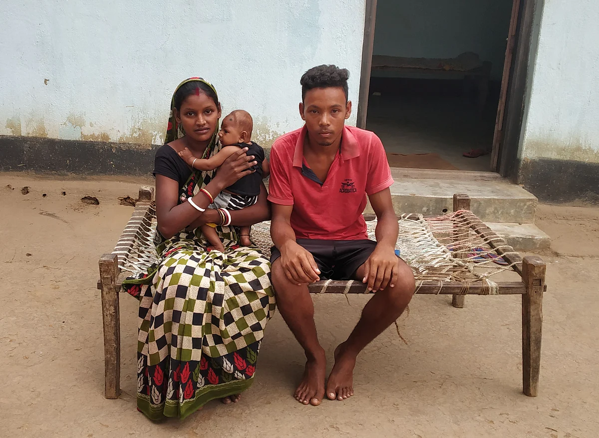 Rani Gope sitting with her husband.