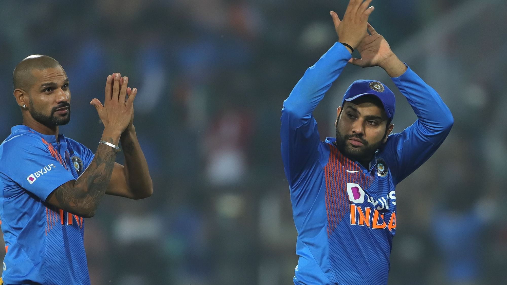 Rohit Sharma and Shikhar Dhawan applaud the stands after winning the T20I series against Bangladesh on Sunday.