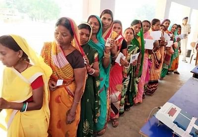 Godda: People queue-up to cast their votes during the seventh and the last phase of 2019 Lok Sabha Elections at a polling booth in Godda, Jharkhand on May 19, 2019. (Photo: IANS)