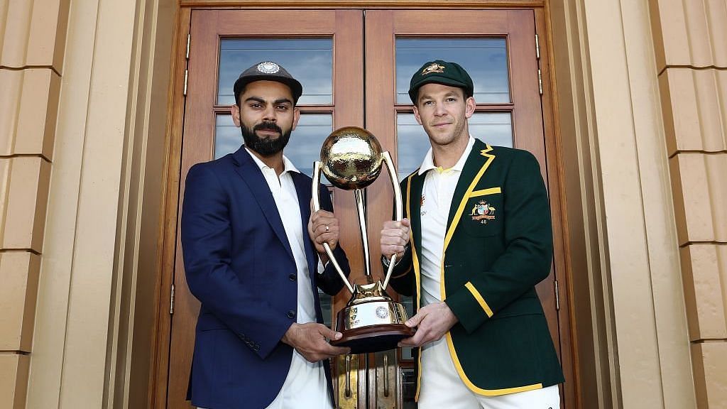 Captains Virat Kohli and Tim Paine pose with the trophy ahead of India’s opening Test vs Australia at Adelaide.