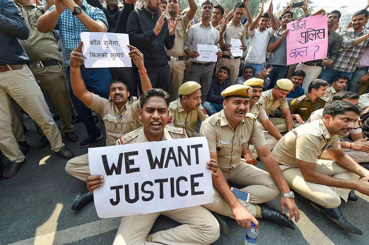 Police personnel displayed placards during a protest against the repeated incidents of alleged violence against them by lawyers including the Tis Hazari Court clashes, on Tuesday, 5 November.