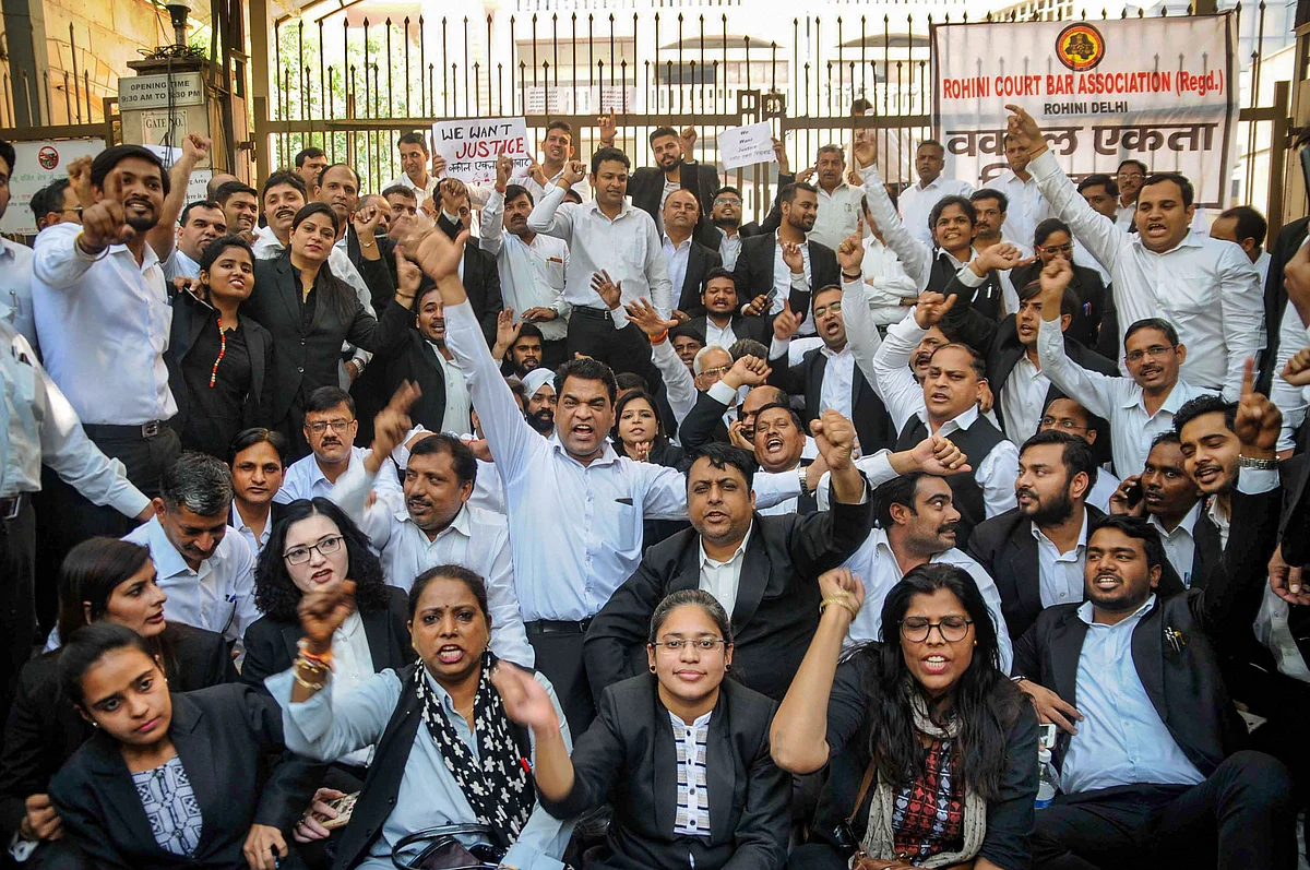 Advocates staged a protest outside Rohini Court over clashes between lawyers and police at Tis Hazari Court complex, in New Delhi, on Wednesday, 6 November.