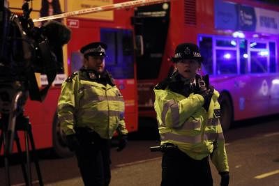 LONDON, Nov. 29, 2019 (Xinhua) -- Police officers cordon off the scene in the south side of London Bridge following an attack in London, Britain, on Nov. 29, 2019. Police confirmed on Friday that two people who were injured in a London Bridge terror incident have died and three others were treated in hospital. (Photo by Isabel Infantes/Xinhua/IANS)