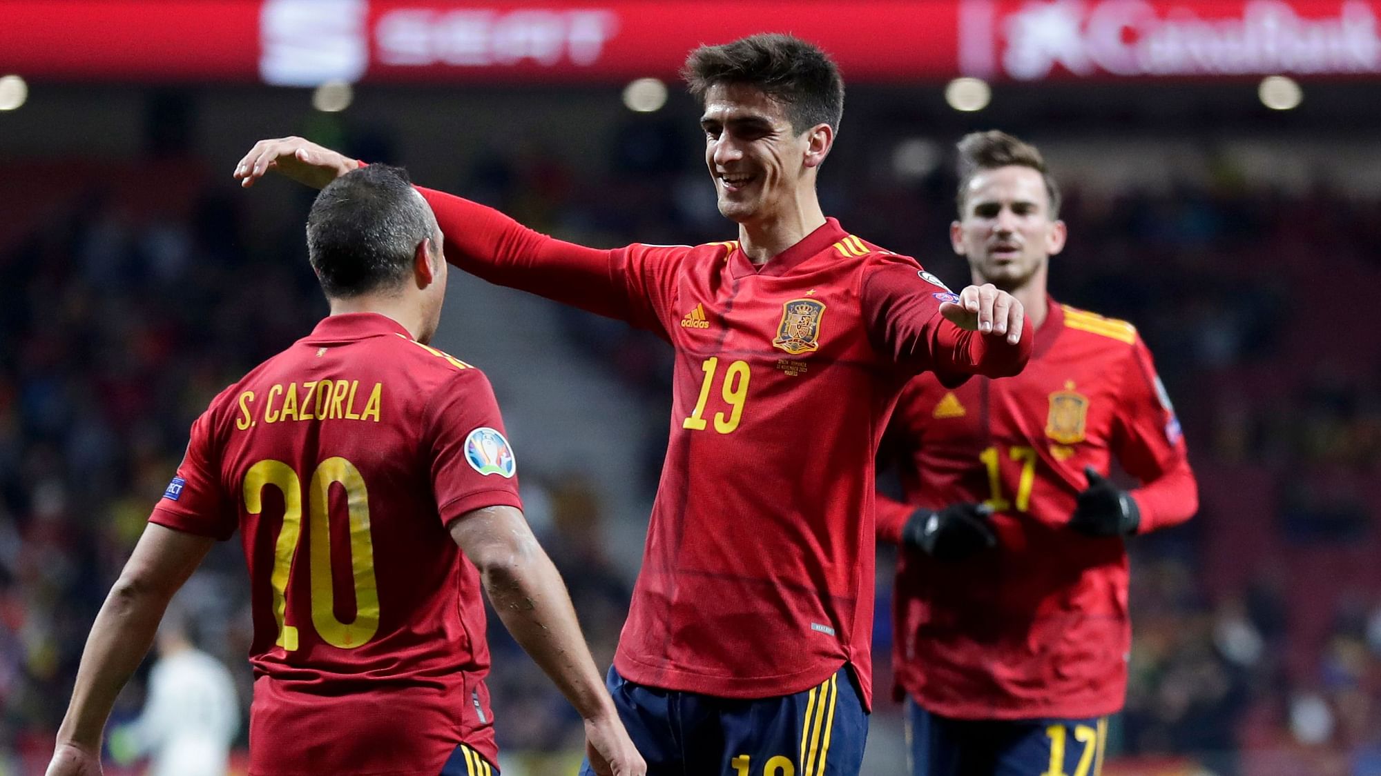 Spain’s Gerard Moreno celebrates with Santi Carzola, left, after scoring his side’s second goal during the Euro 2020 group F qualifying game between Spain and Romania at the Metropolitano stadium in Madrid.