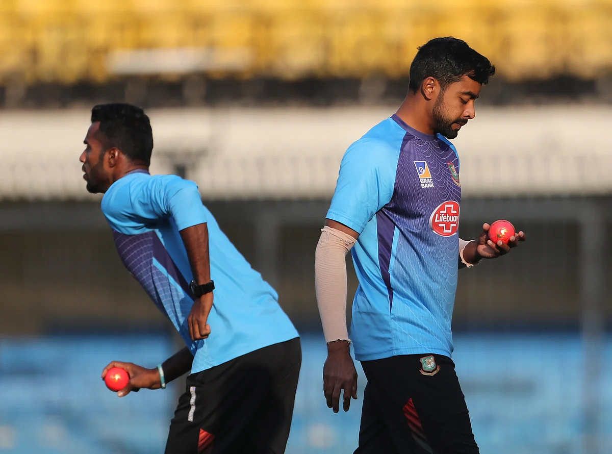 Bangladesh’s Abu Jayed, right, and Ebadot Hossain hold the new pink balls as they prepare to bowl in the nets during a training session.