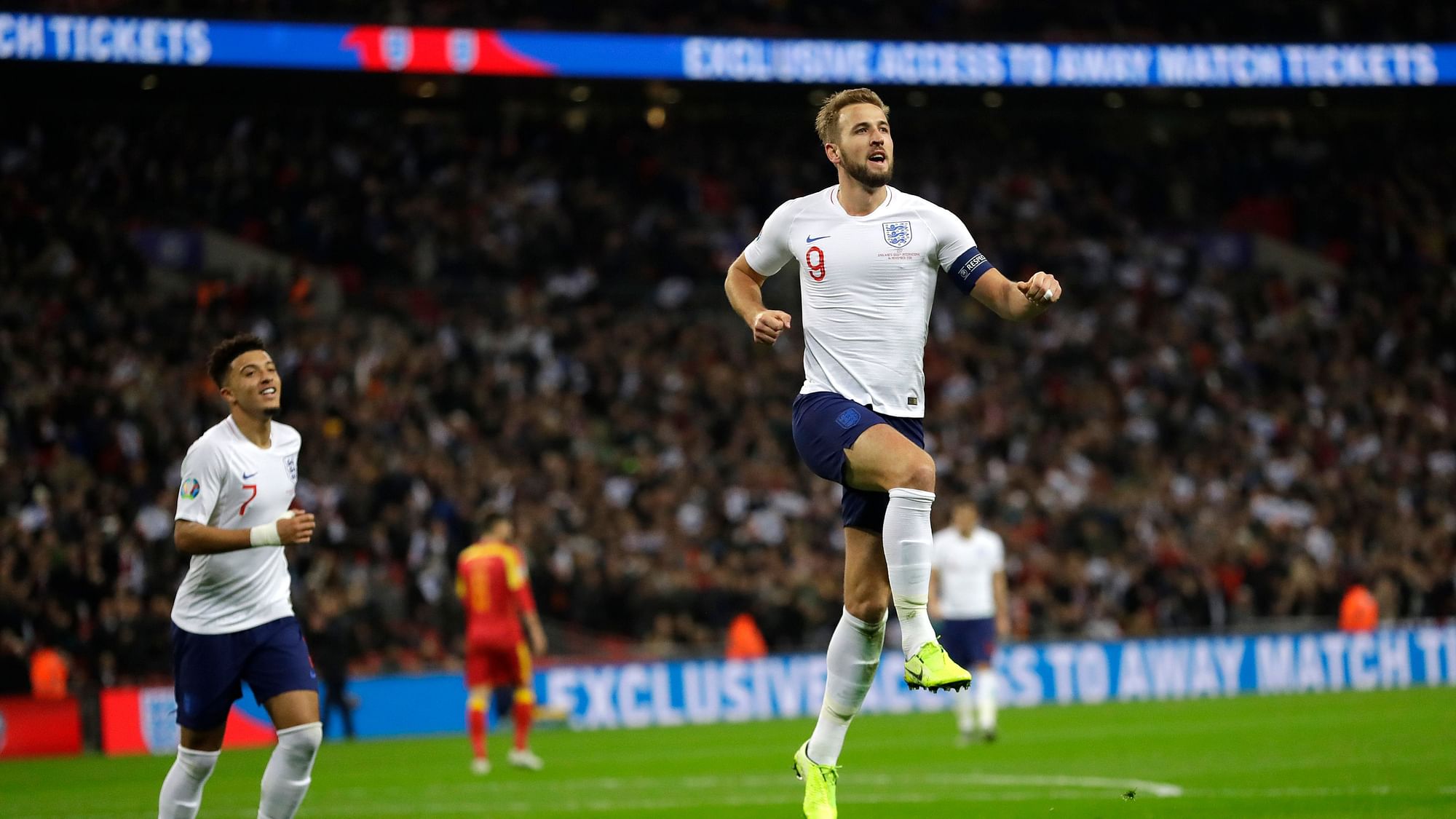 England’s Harry Kane, right, celebrates scoring the fifth goal during the Euro 2020 group A qualifying football match between England and Montenegro at Wembley stadium in London.