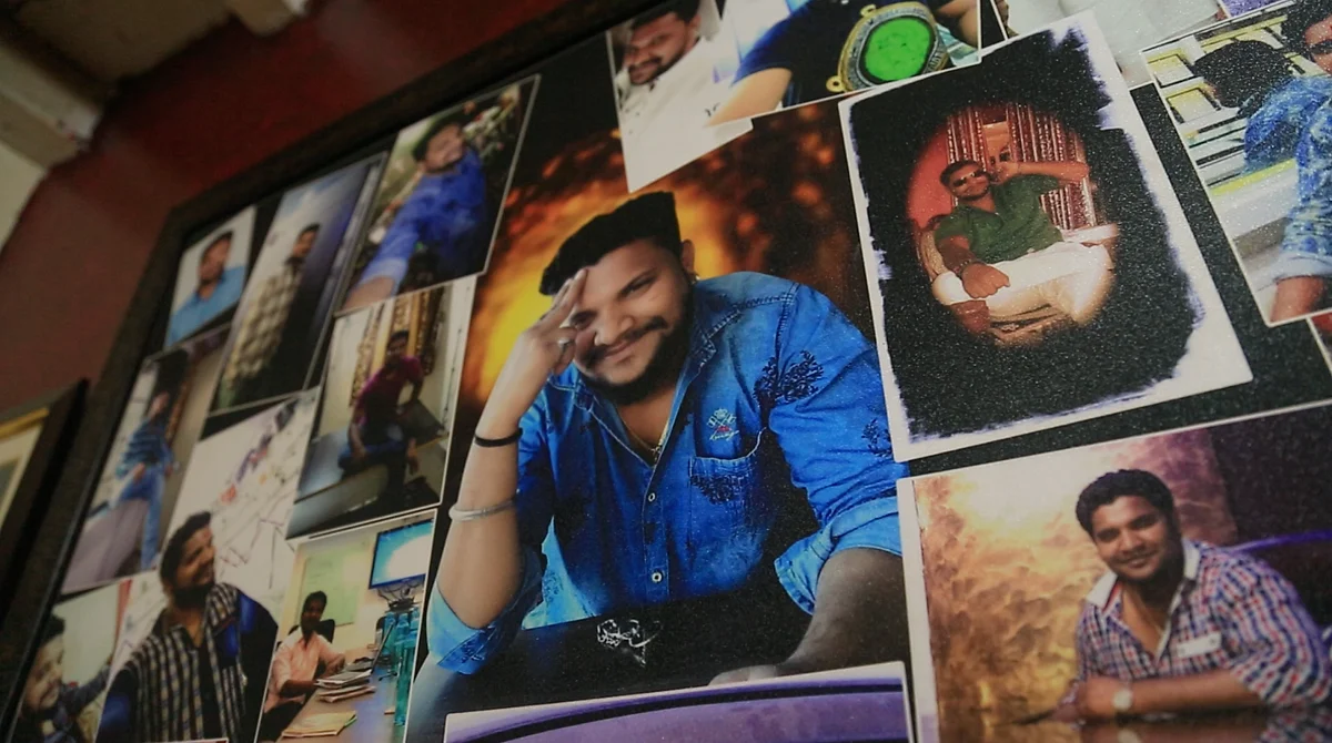 A frame of Kalpesh's photos in the Jadhav house.