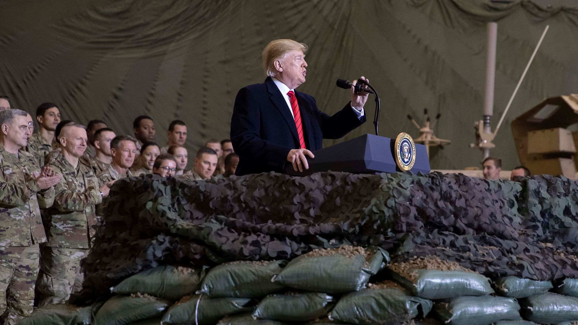 US President Donald Trump addresses members of the military during a surprise Thanksgiving Day visit on Thursday, 28 November, at Bagram Air Field, Afghanistan. 