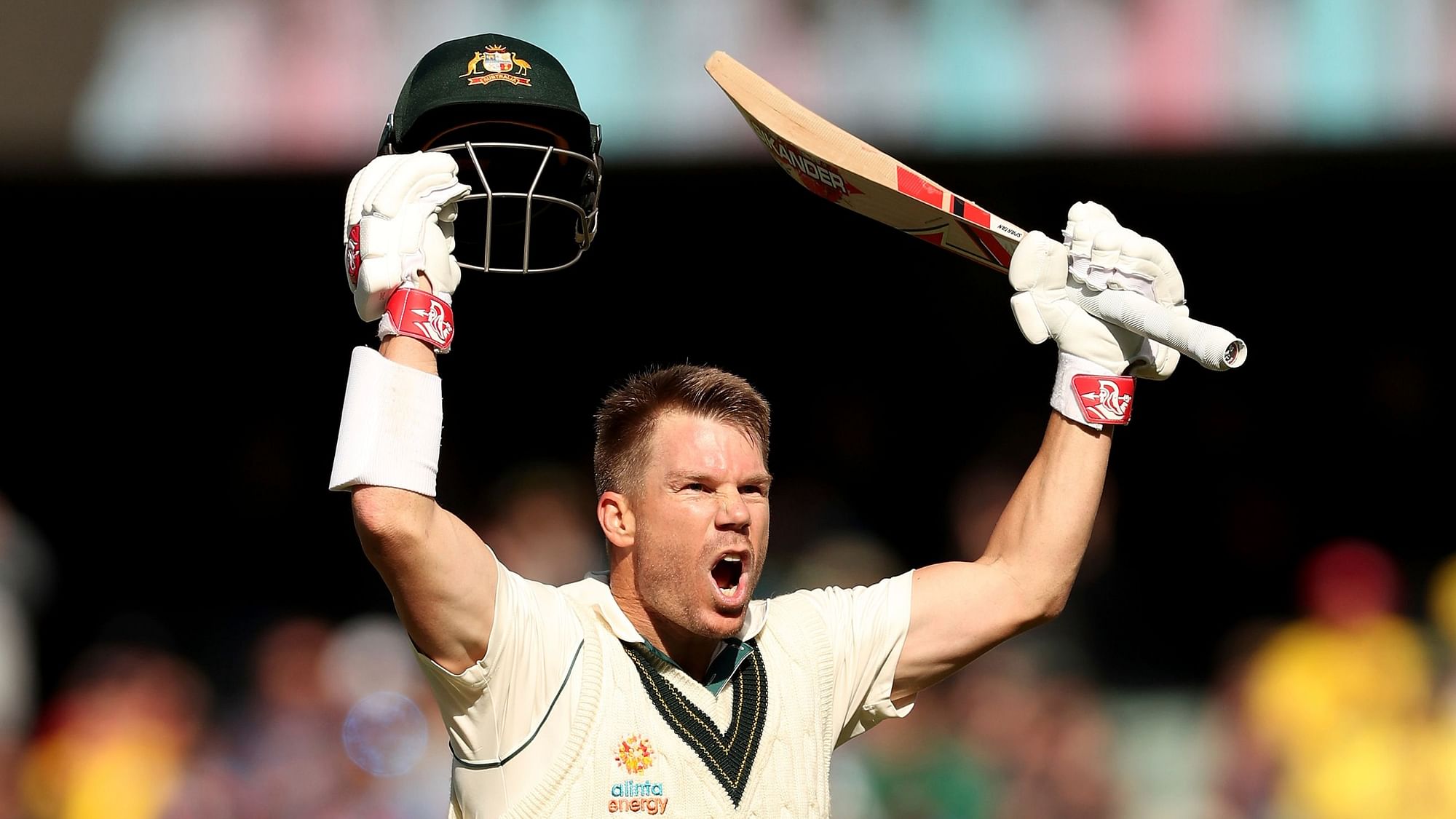 David Warner walked off the Adelaide Oval with his bat held aloft in one hand and his helmet in the other.