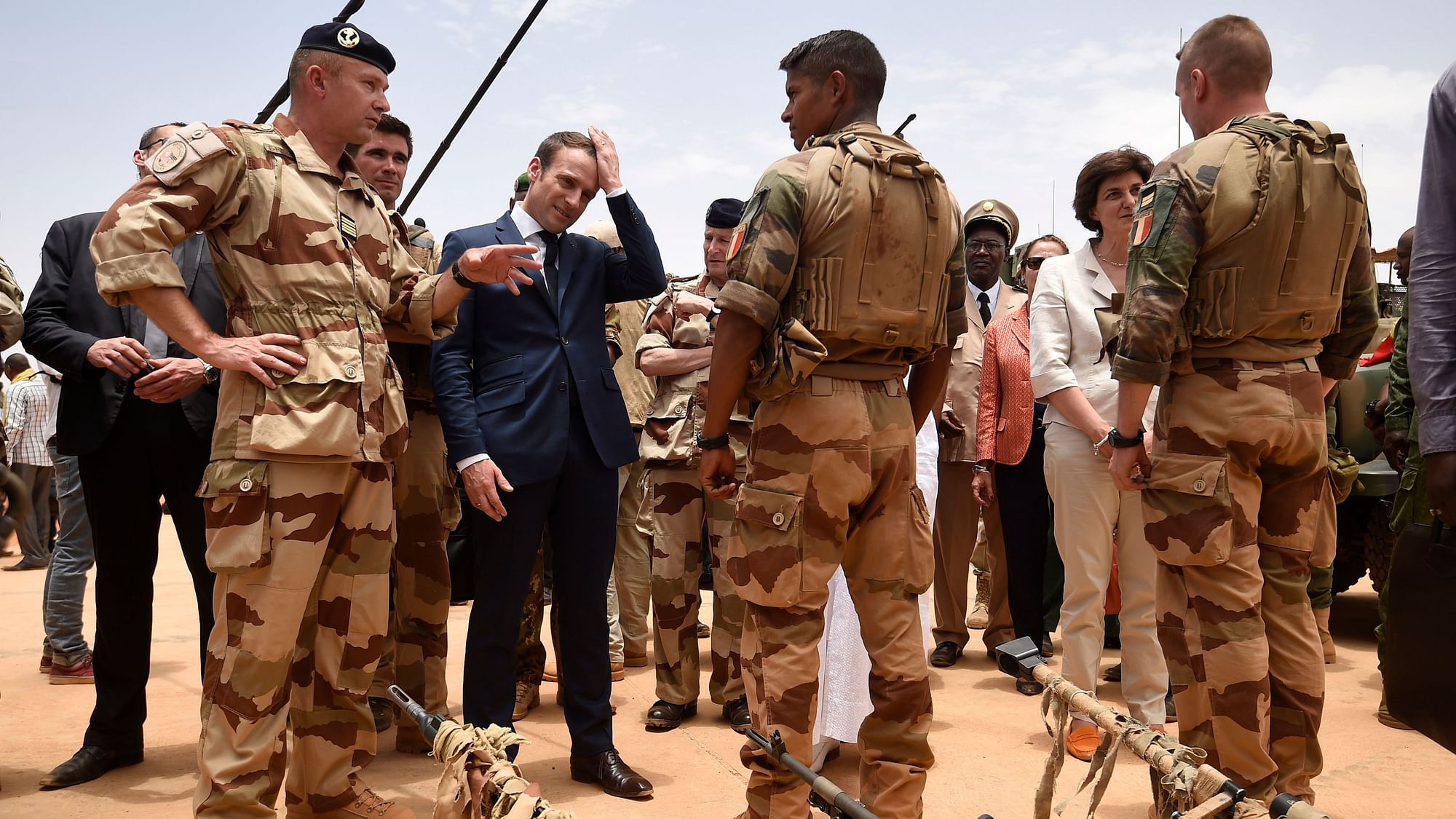 In 19 May 2017 file photo, French President Emmanuel Macron, center left, visits soldiers of Operation Barkhane, France’s largest overseas military operation, in Gao, Northern Mali.&nbsp;