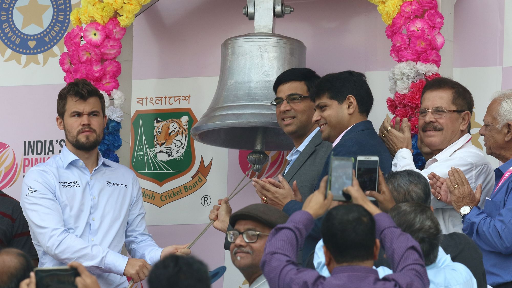 Indian chess Grandmaster Viswanathan Anand&nbsp; &amp; World Champions Magnus Carlsen ringing the bell ahead of Day 2 of the Pink Ball Test match between India and Bangladesh at the Eden Gardens.
