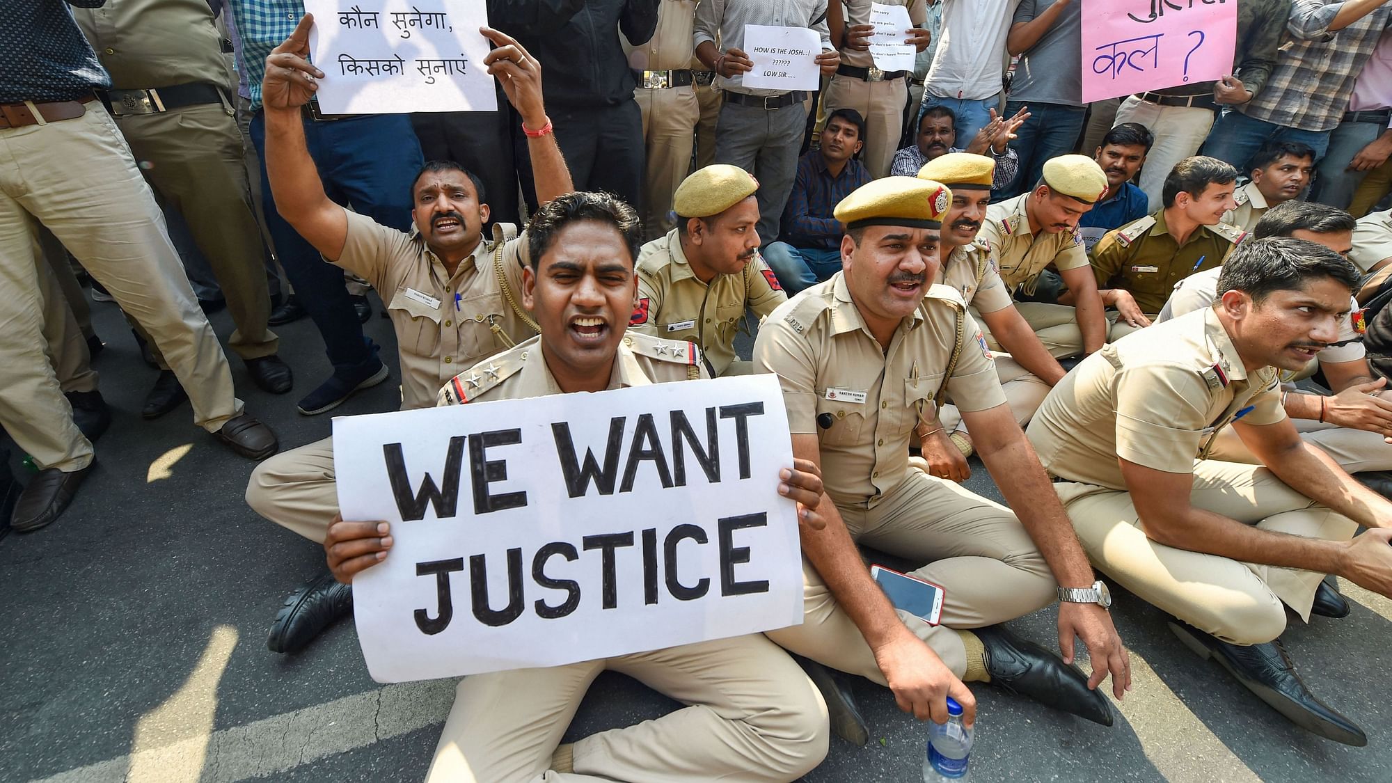 Police personnel displayed placards during a protest against the repeated incidents of alleged violence against them by lawyers including the Tis Hazari Court clashes, on Tuesday, 5 November.