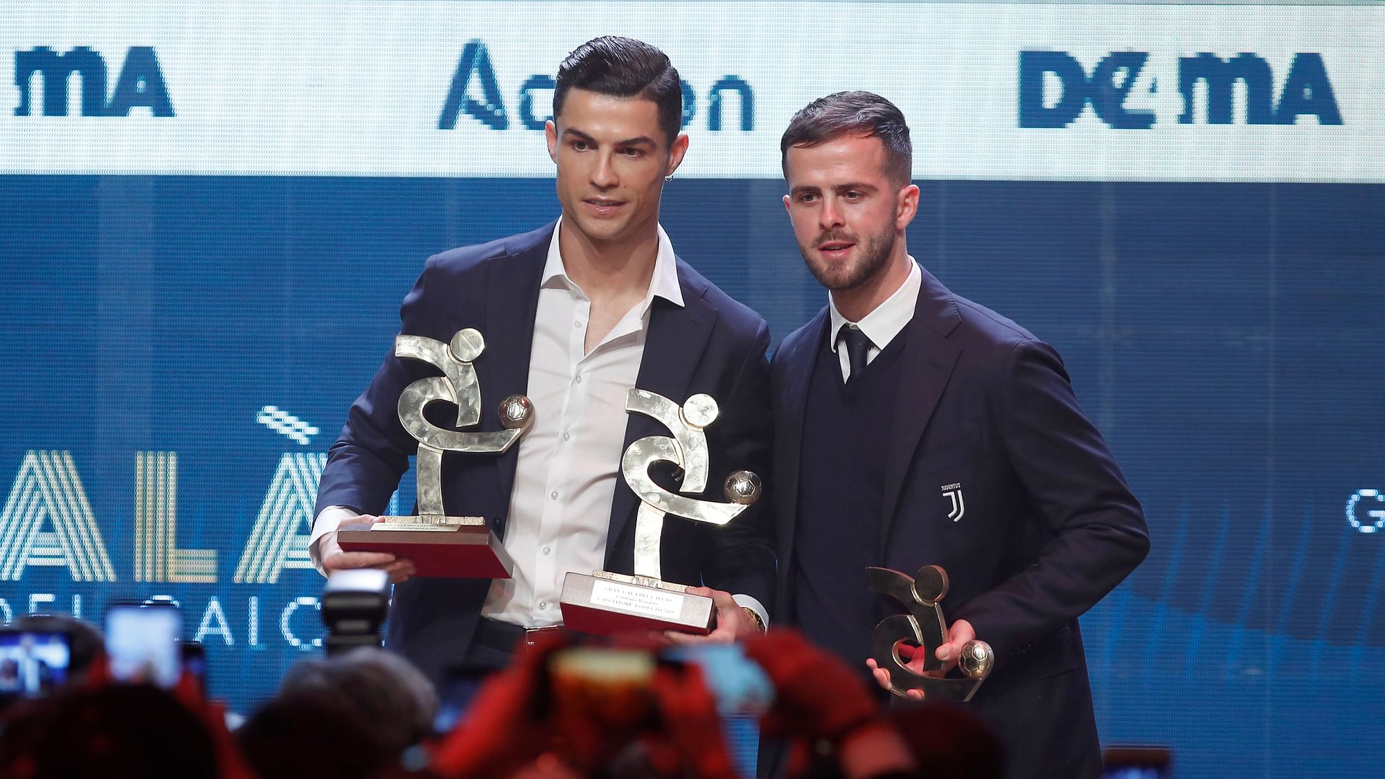 Juventus’ Cristiano Ronaldo, left, stands with the trophy for best Italian Serie A player, as he poses with his teammate Miralem Pjanic, winner of the best Italian Serie A midfielder, during the Gran Gala’ soccer awards ceremony, in Milan, Italy, Monday, Dec. 2, 2019.&nbsp;
