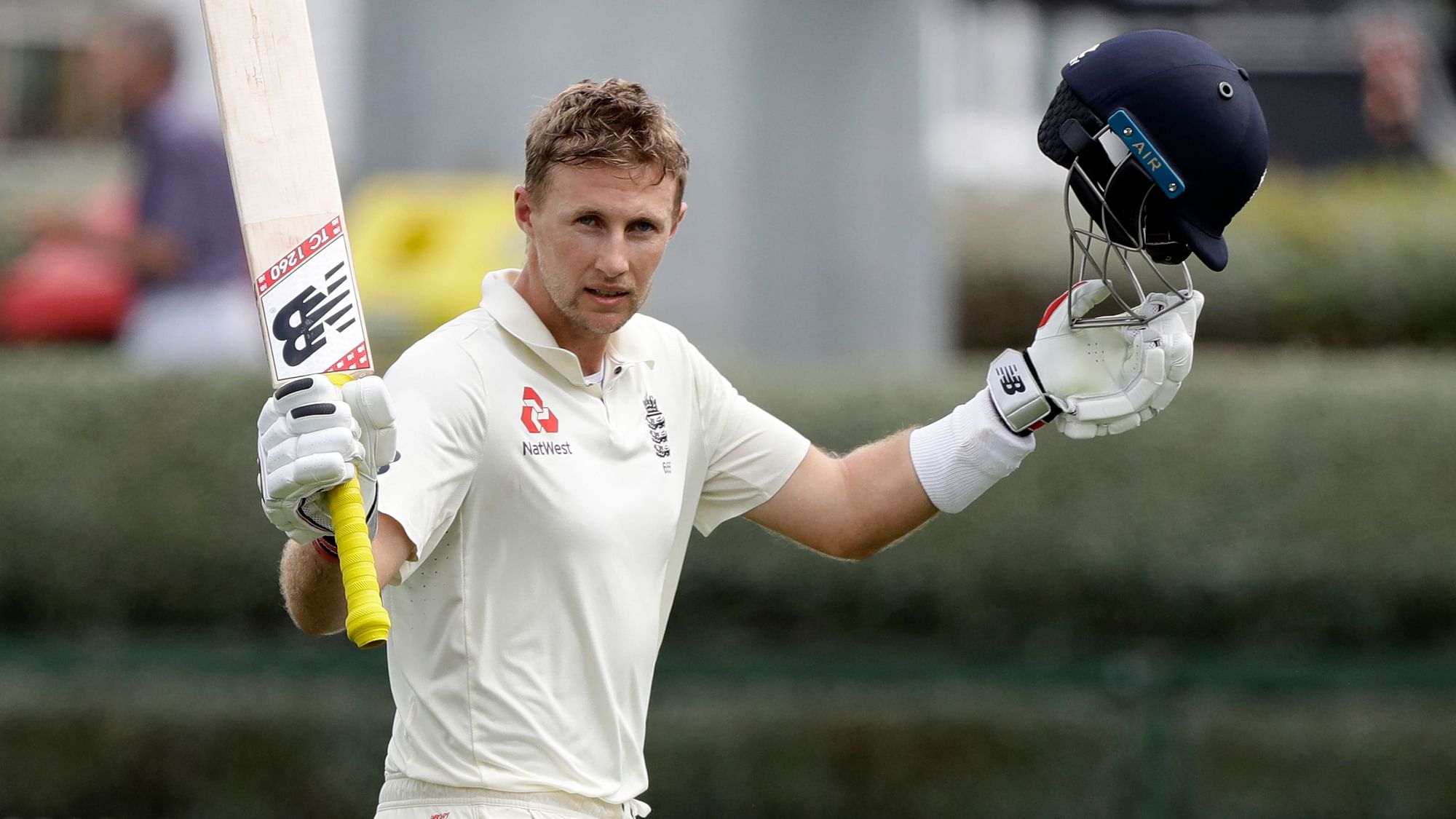 England’s Captain Joe Root waves to the crowd as he leaves the field after he was dismissed for 226 runs during play on day four of the second cricket Test between England and New Zealand at Seddon Park in Hamilton on Monday, 2 December.