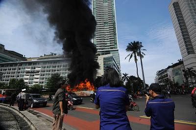 JAKARTA, Dec. 16, 2013 (Xinhua) -- A bus is on fire in the main road of Sudirman Street in Jakarta, Indonesia, Dec. 16, 2013. There were no fatalities in this accident. (Xinhua/Veri Sanovri)