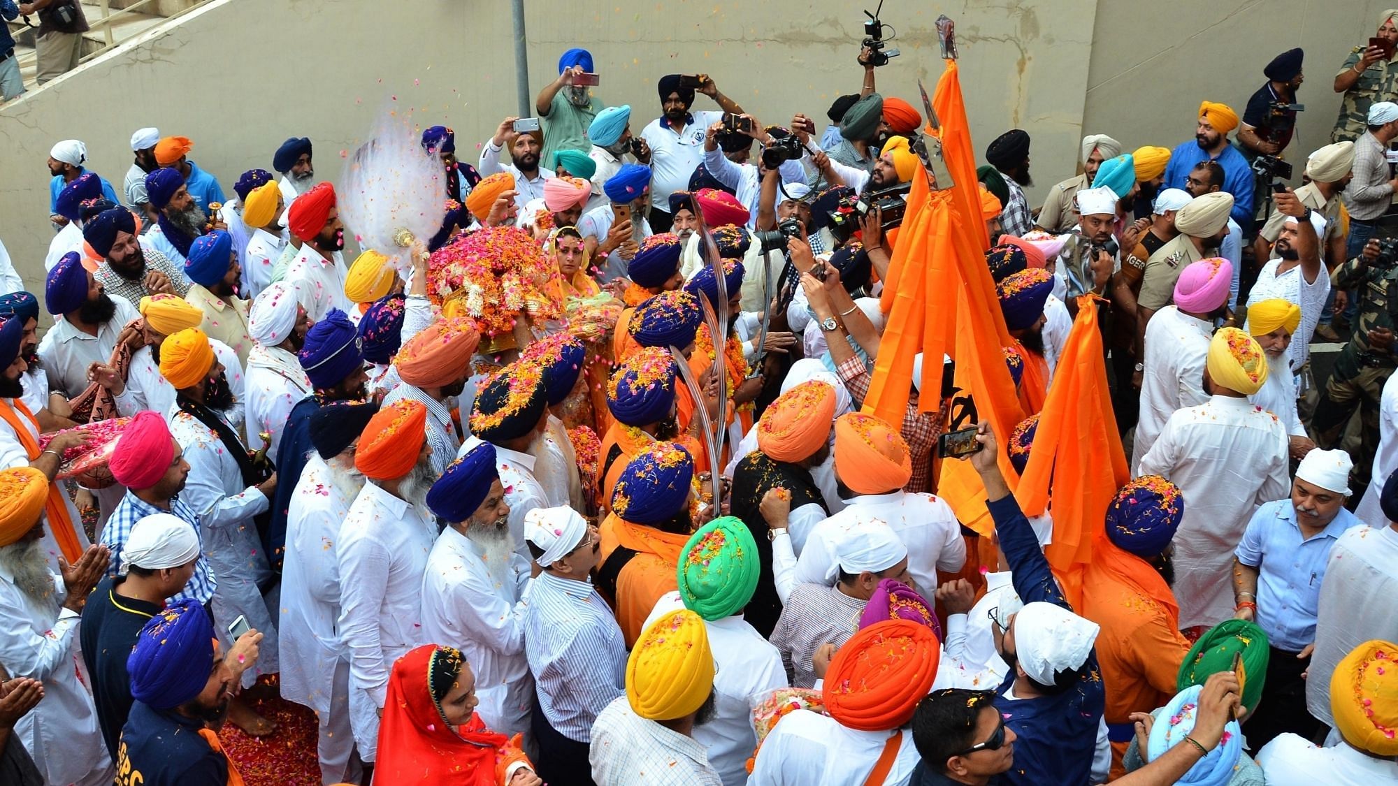 Sikh devotees participating in International ‘Nagar Kirtan’ from Gurdwara Nankana Sahib in Pakistan’s Nankana Sahib district across the Attari-Wagah border proceeding towards India, in Punjab’s Attari on 1 August 2019. Image used for representational purposes.