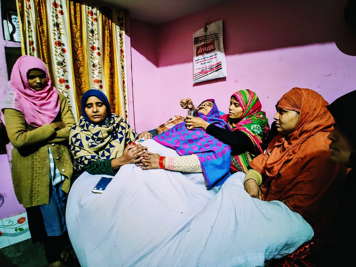 This is Suleiman’s family with their mother in the pink polka dot shawl. The family says she has not eaten and slept since her son died. 