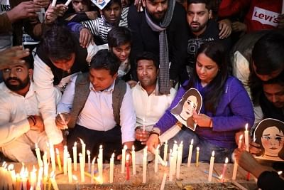 New Delhi: Youth Congress activists participate in a candlelight vigil to protest against the death of Unnao rape victim, highlighting the rise in incidents of crimes against women, in New Delhi on Dec 7, 2019. (Photo: IANS)