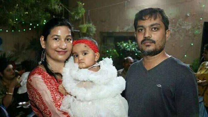 Ekta and Ravi Shekhar with their child.