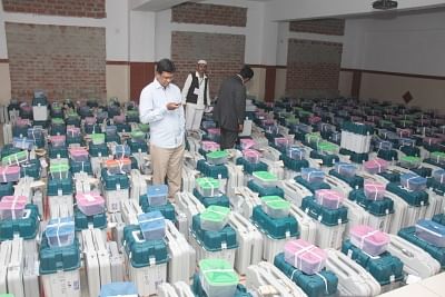 Bengaluru: Polling officials at a strong room where Electronic Voting Machines (EVM) are kept after the second phase of 2019 Lok Sabha polls, in Bengaluru, on April 19, 2019. (Photo: IANS)