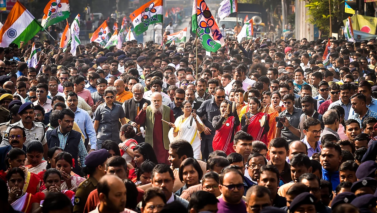 TMC Supremo and West Bengal Chief Minister Mamata Banerjee plays a musical instrument while leading a protest against CAA and NRC, in Kolkata on Tuesday, 24 December.