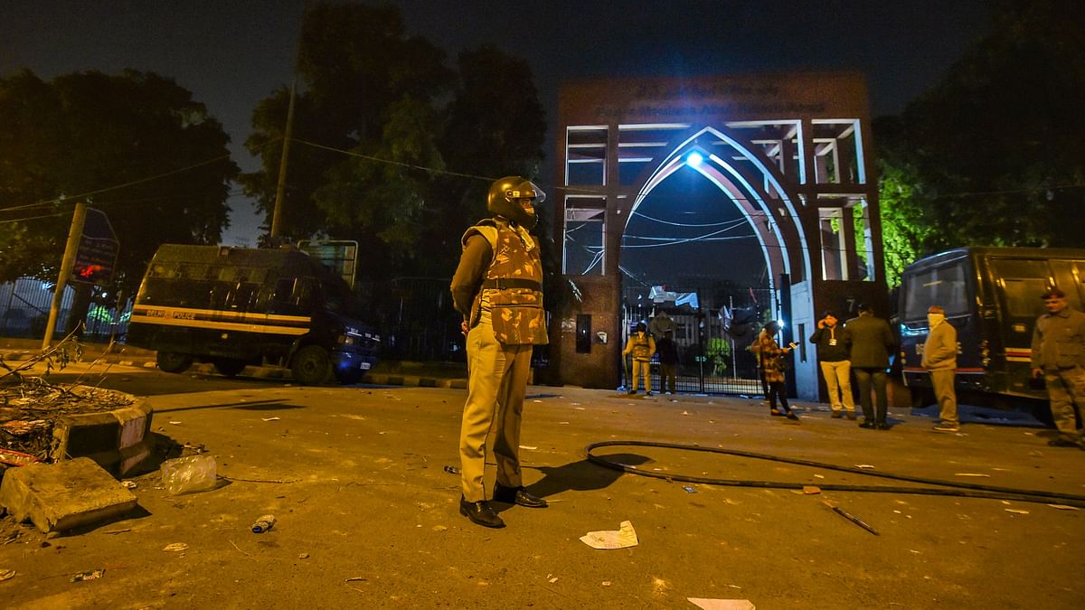 Policeman standing guard outside Jamia Millia Islamia University on Sunday, 15 December.