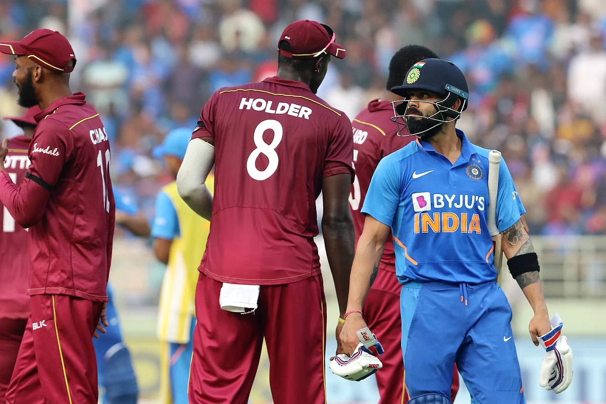 Virat Kohli, captain of India, walks back to the pavilion after getting out during the 2nd ODI between India and the West Indies held at the ACA-VDCA Stadium.