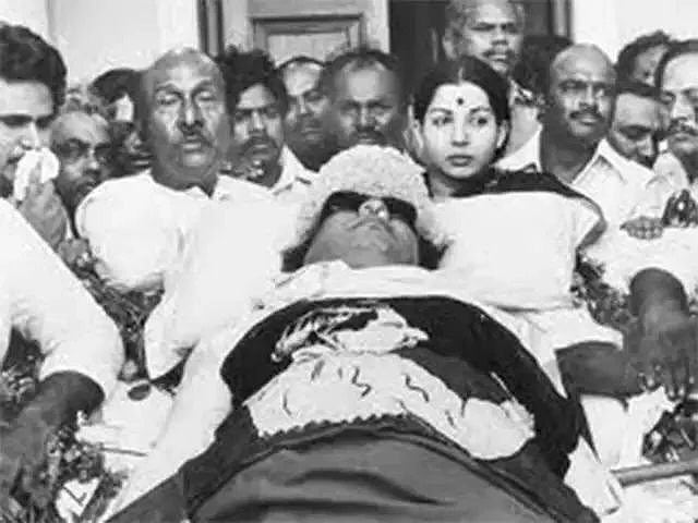 Jayalalithaa standing by MGR’s body when he died in 1987.